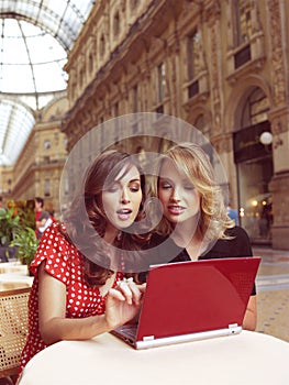 Happy businesswomen with laptop
