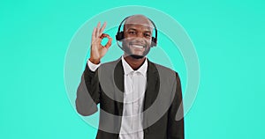 Happy, call center and man consultant in studio with a perfect hand sign for communication. Customer support, portrait