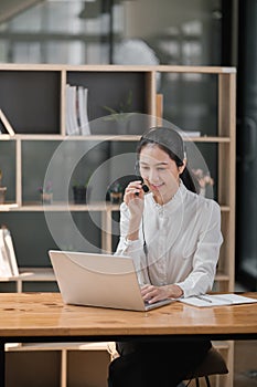 Happy call center woman consulting customer for customer support, help or telemarketing sales. Sales advisor, CRM girl