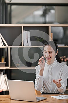 Happy call center woman consulting customer for customer support, help or telemarketing sales. Sales advisor, CRM girl