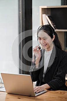 Happy call center woman consulting customer for customer support, help or telemarketing sales. Sales advisor, CRM girl