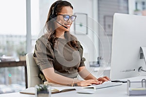 Happy, call center and a woman typing on a computer for telemarketing, consulting and customer service. Smile, contact