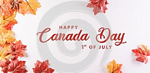 Happy Canada Day concept made from red silk maple leaves with the text on white background