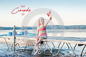 Happy Canada Day. Greeting card with text. Caucasian girl sitting on dock pier by lake and waving Canadian flag. Celebration of