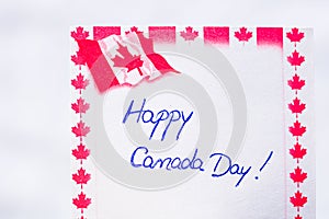 Happy Canada day handwriting on paper with Canada flag. Writing text on memo post reminder. Bucharest, Romania, 2020