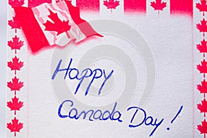 Happy Canada day handwriting on paper with Canada flag. Writing text on memo post reminder. Bucharest, Romania, 2020