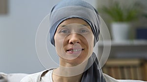 Happy cancer survivor woman smiling at camera, remission and hope for recovery