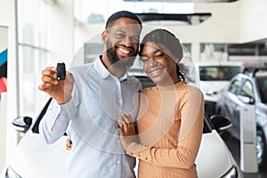 Happy Car Owners. Portrait Of Young Black Couple Posing With Automobile Keys