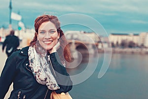 Happy carefree woman toothy smile on Margaret bridge, Budapest,