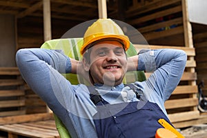 Happy carpenter resting