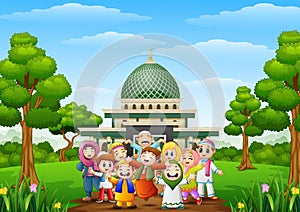 Happy cartoon kids celebrate eid mubarak with islamic mosque in the forest