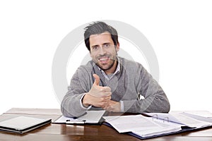 Happy casual man on a desk