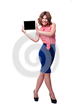 Happy casual woman showing tablet computer screen