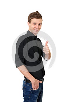 Happy casual young man showing thumb up