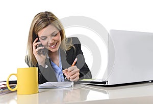 Happy Caucasian blond business woman working talking on mobile phone