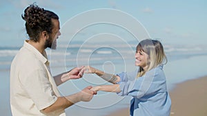 Happy Caucasian couple having fun at the beach