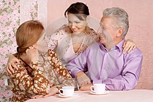 Happy Caucasian elderly parents with a daughter