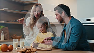 Happy Caucasian family medical insurance loan mortgage credit parents child kid daughter breakfast together at kitchen