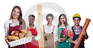 Happy caucasian female baker with group of other international a