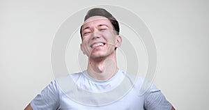 Happy Caucasian Man Laughing on White Background