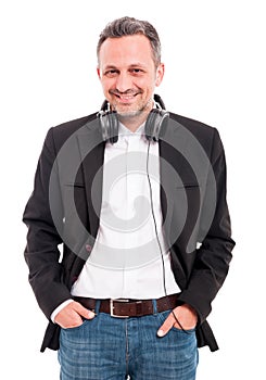 Happy caucasian man wearing headphones around neck