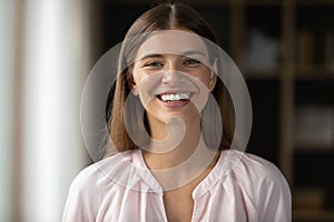 Happy Caucasian woman with perfect white teeth looking at camera