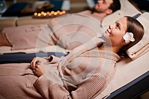 Happy caucasian young couple relaxing together at day spa