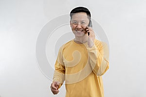 Happy caucasian young man using smart phone cellphone for calls, social media, mobile application online