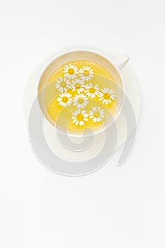 Happy chamomile tea with fresh flowers