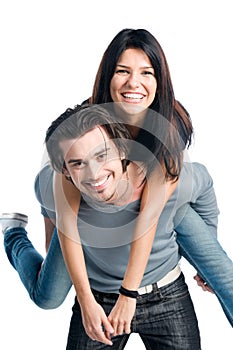 Happy cheerful couple piggyback photo