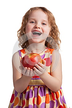 Happy cheerful girl with a ripe apple