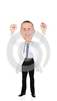 Happy cheerful male doctor with raised arms