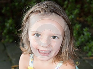 An happy cheerful portrait child girl