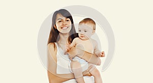 Happy cheerful smiling young mother holding baby on white background