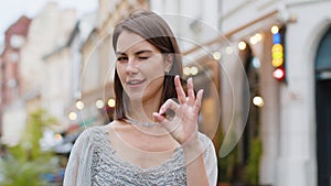 Happy cheerful woman girl showing ok gesture, positive like sign, approve something good, celebrate