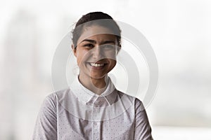 Happy cheerful young Indian business professional woman head shot