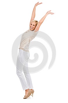 Happy, cheering and woman with arms up celebration in studio for fashion, sale or promo on white background. Excited