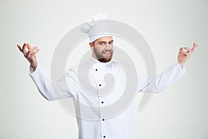 Happy chef cook showing welcome gesture
