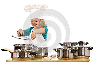 Happy chef stirring soup in a bowl