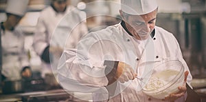 Happy chef whisking cream