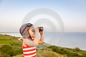 Happy child against blue sea and sky background
