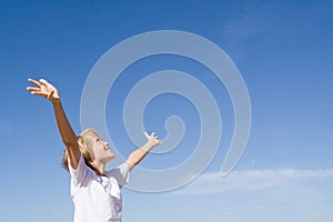 Happy child arms raised