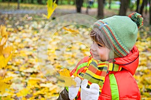Happy child in autumn park