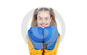 happy child boxer in boxing gloves ready to fight and punch  on white, activity