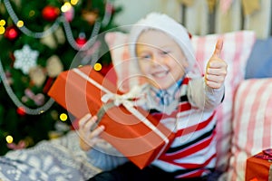 Happy child boy with Christmas gifts