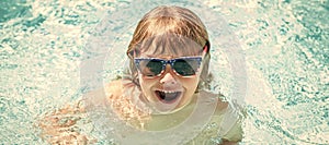 happy child boy in glasses swimming in pool, summer vacation. Horizontal poster design. Web banner header, copy space.