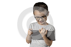 a Happy child boy holding a tablet on white background