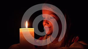 Happy Child with Candles, Prayer Kid in Night, Girl Portrait, Face in Dark