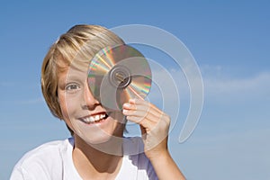 Happy child with cd or dvd