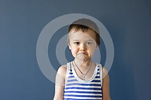 Happy child. ,Close-up portrait of a handsome boy with an angry expression